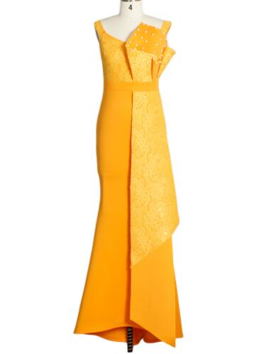 Yellow evening gown on a mannequin against a white background