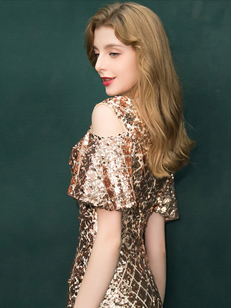 Woman wearing a sequined dress against a green background