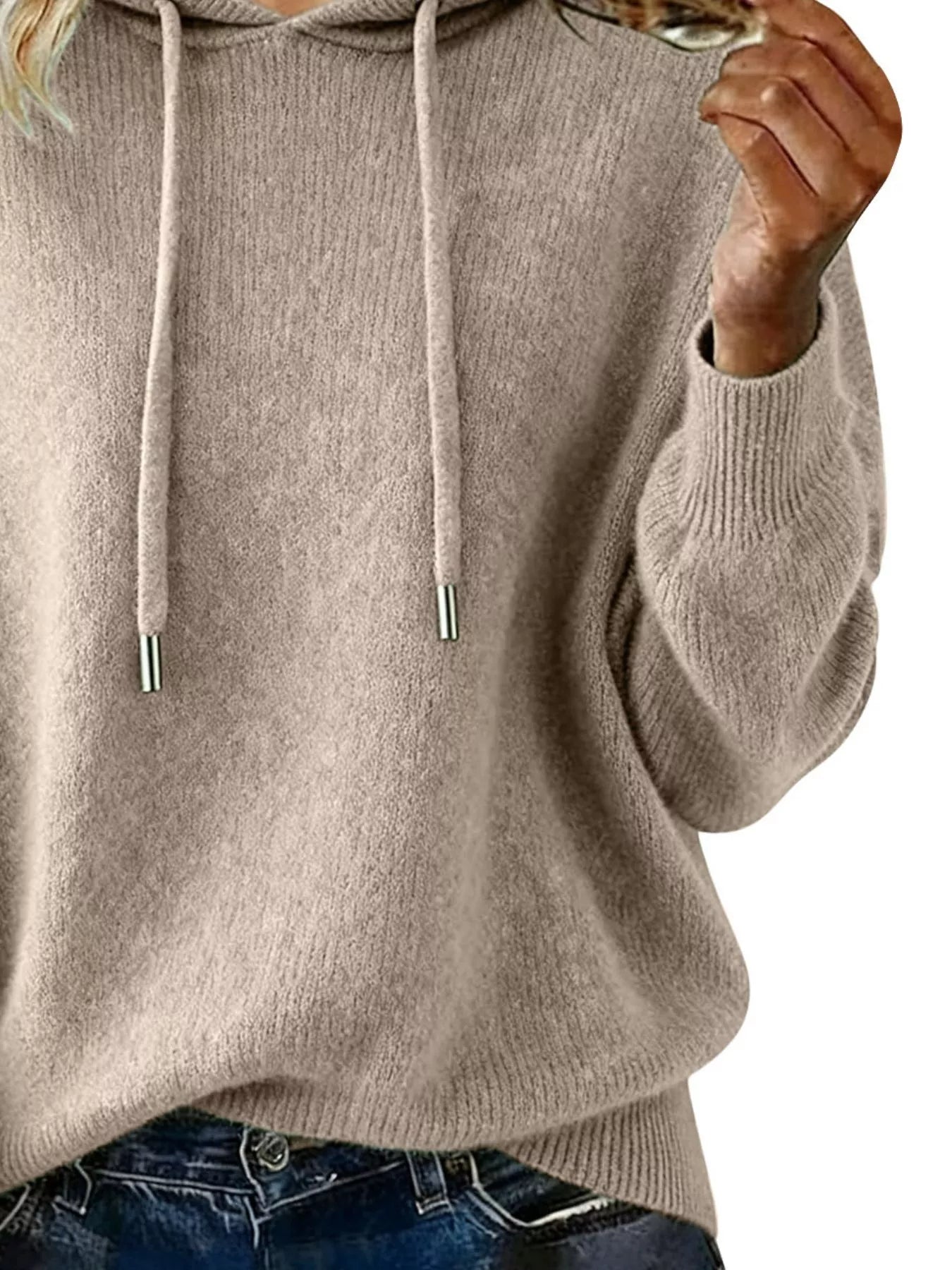 Beige hoodie worn by a person on a white background