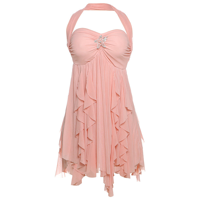 Pink halter neck dress with ruffled layers on a white background