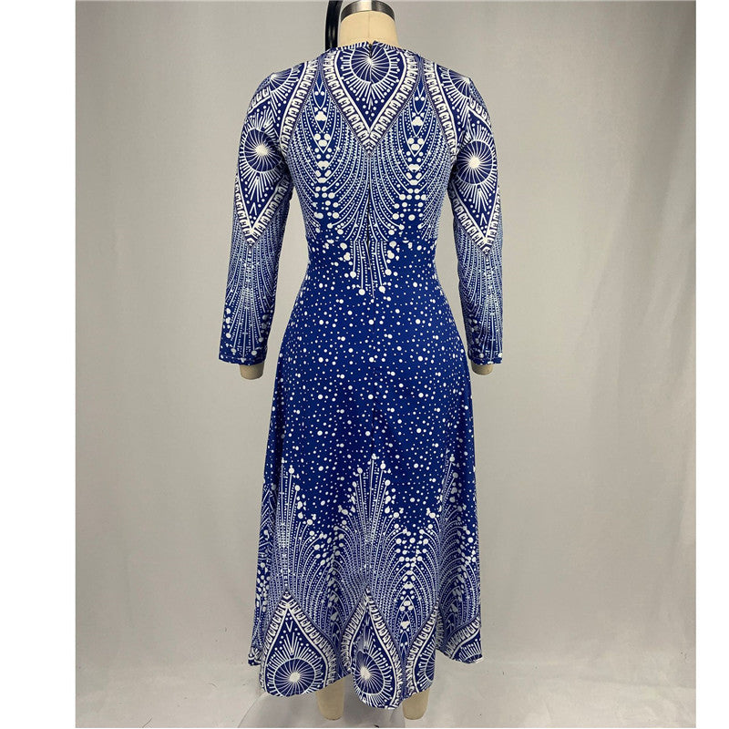 Blue dress with white patterns on a mannequin against a plain background