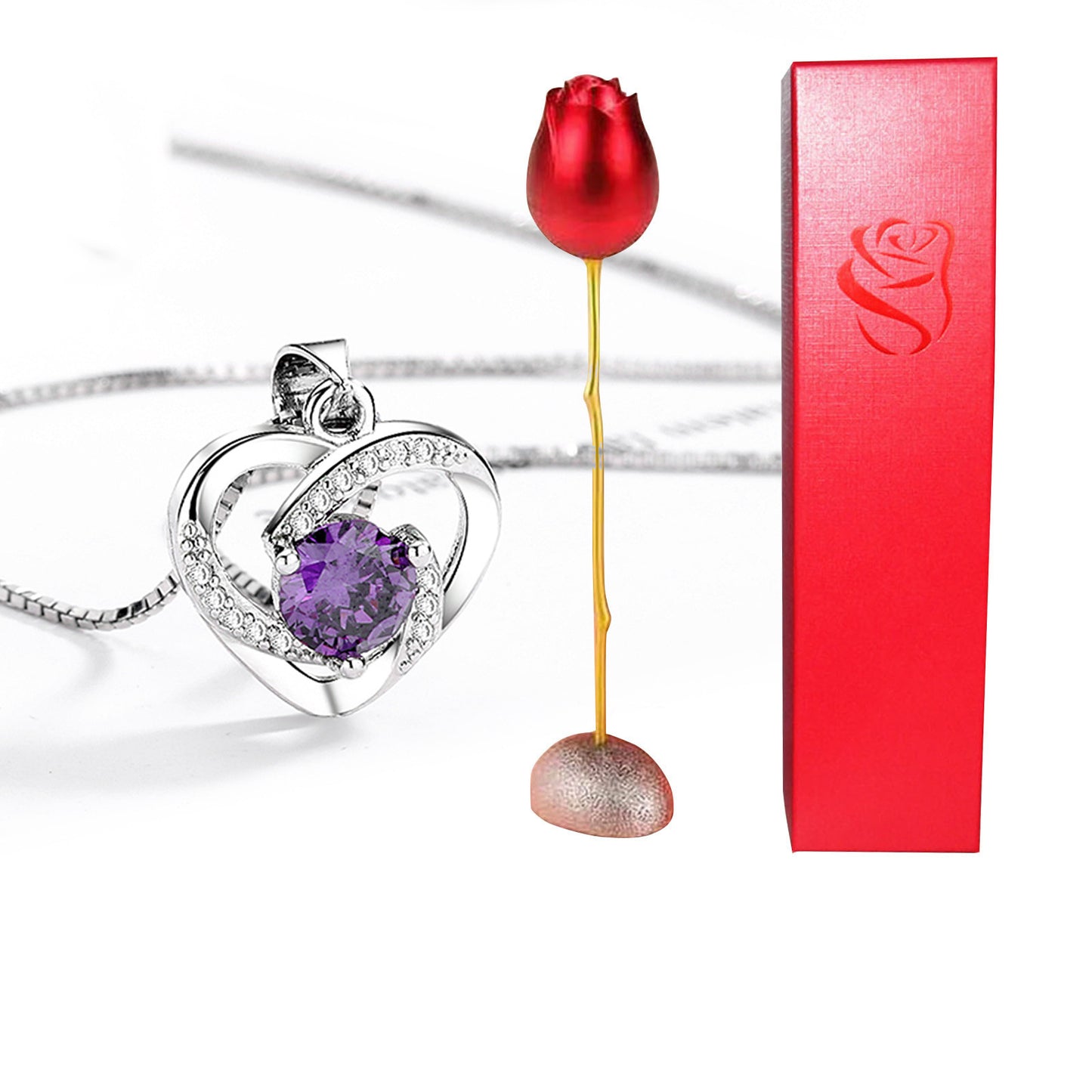 Heart-shaped necklace with purple gemstone, red rose, and red box on white background