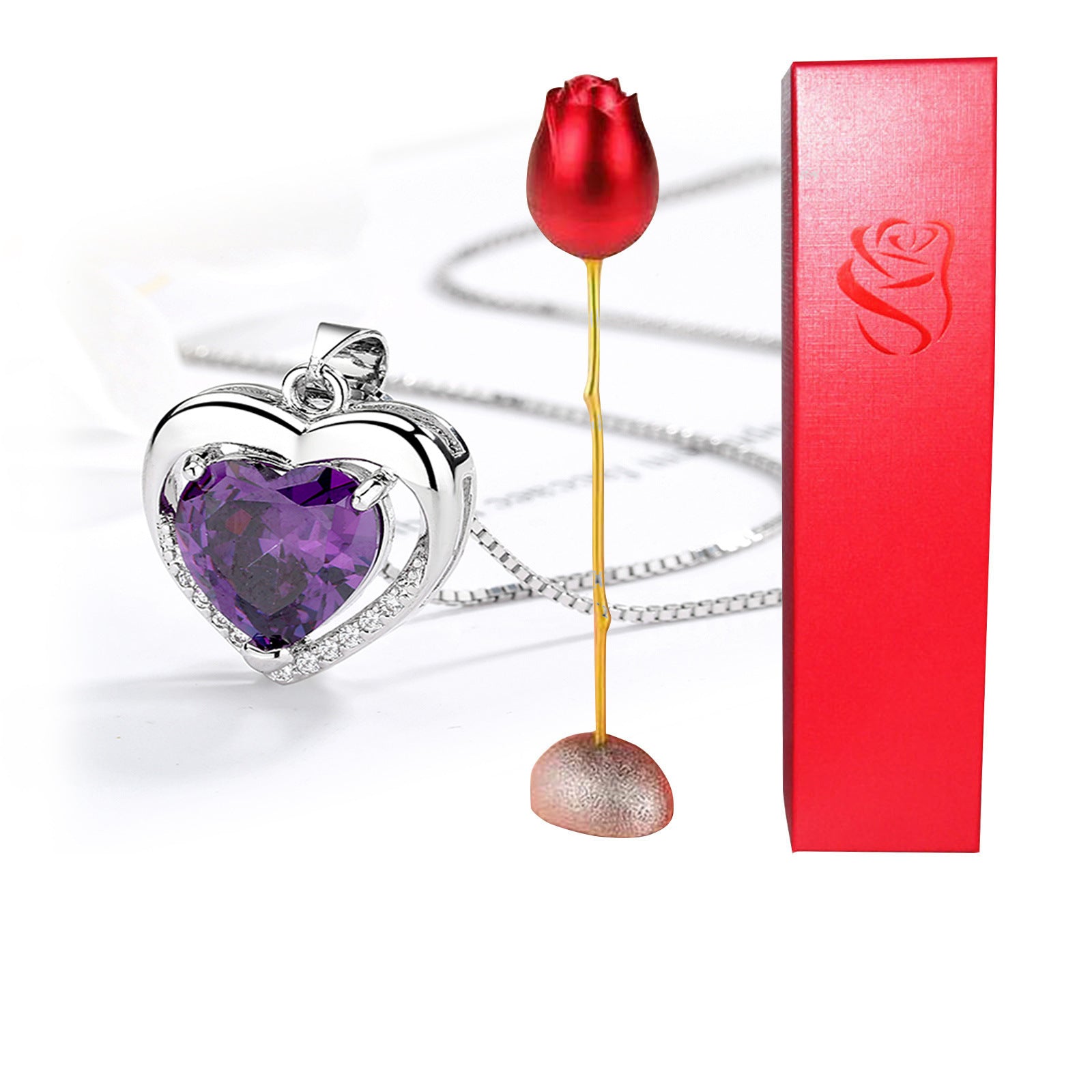 Heart-shaped purple pendant with a red rose and a red box on a white background
