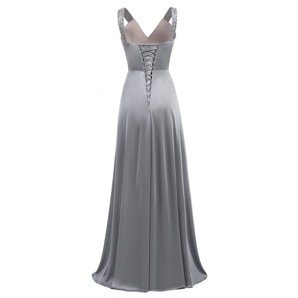 Gray evening gown with lace-up back on a white background