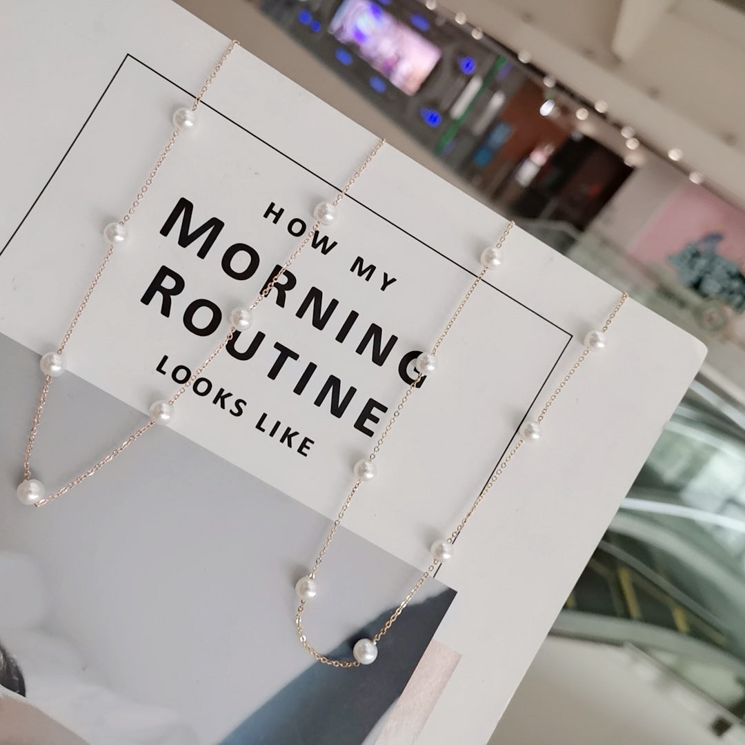Necklace with pearls on a stand labeled 'How my morning routine looks like'.