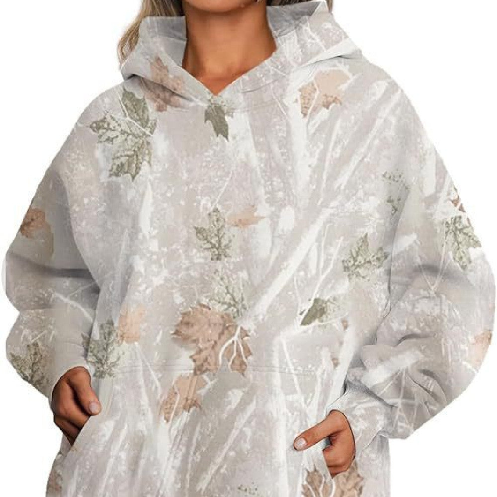 Clear raincoat with floral pattern worn by a person on a white background