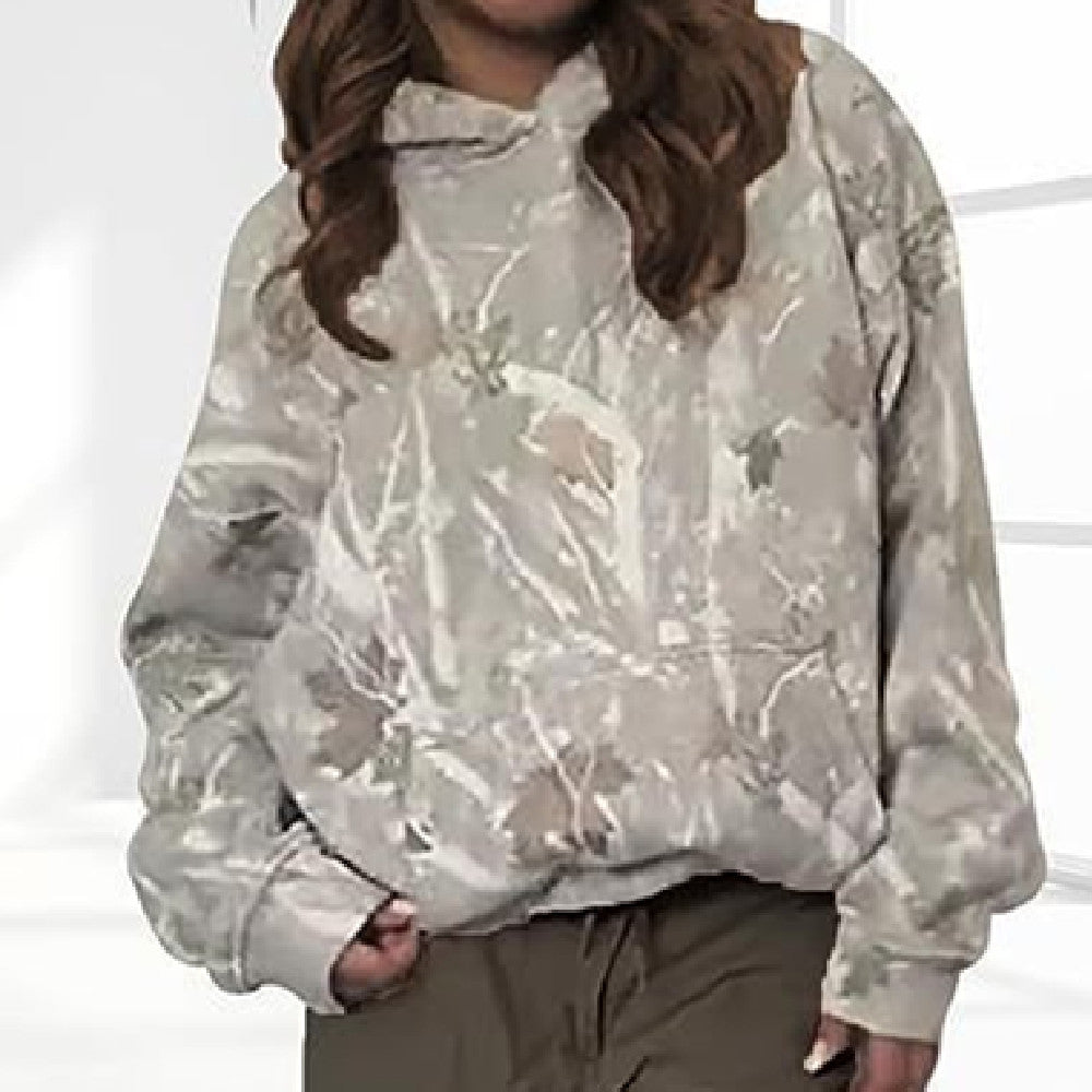 Person wearing a camouflage-patterned jacket on a white background