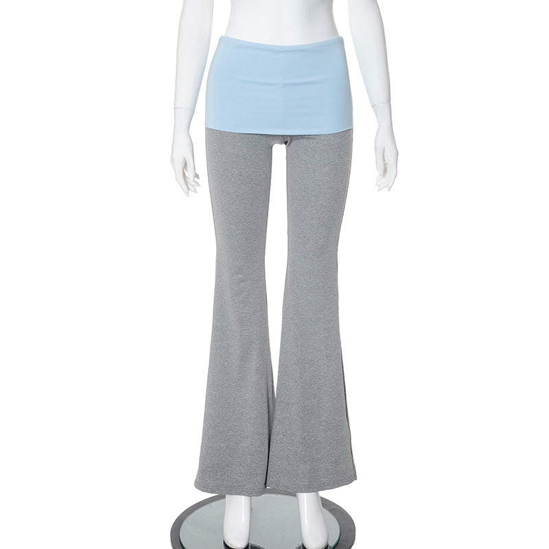 Mannequin wearing gray flared pants over light blue leggings on a white background
