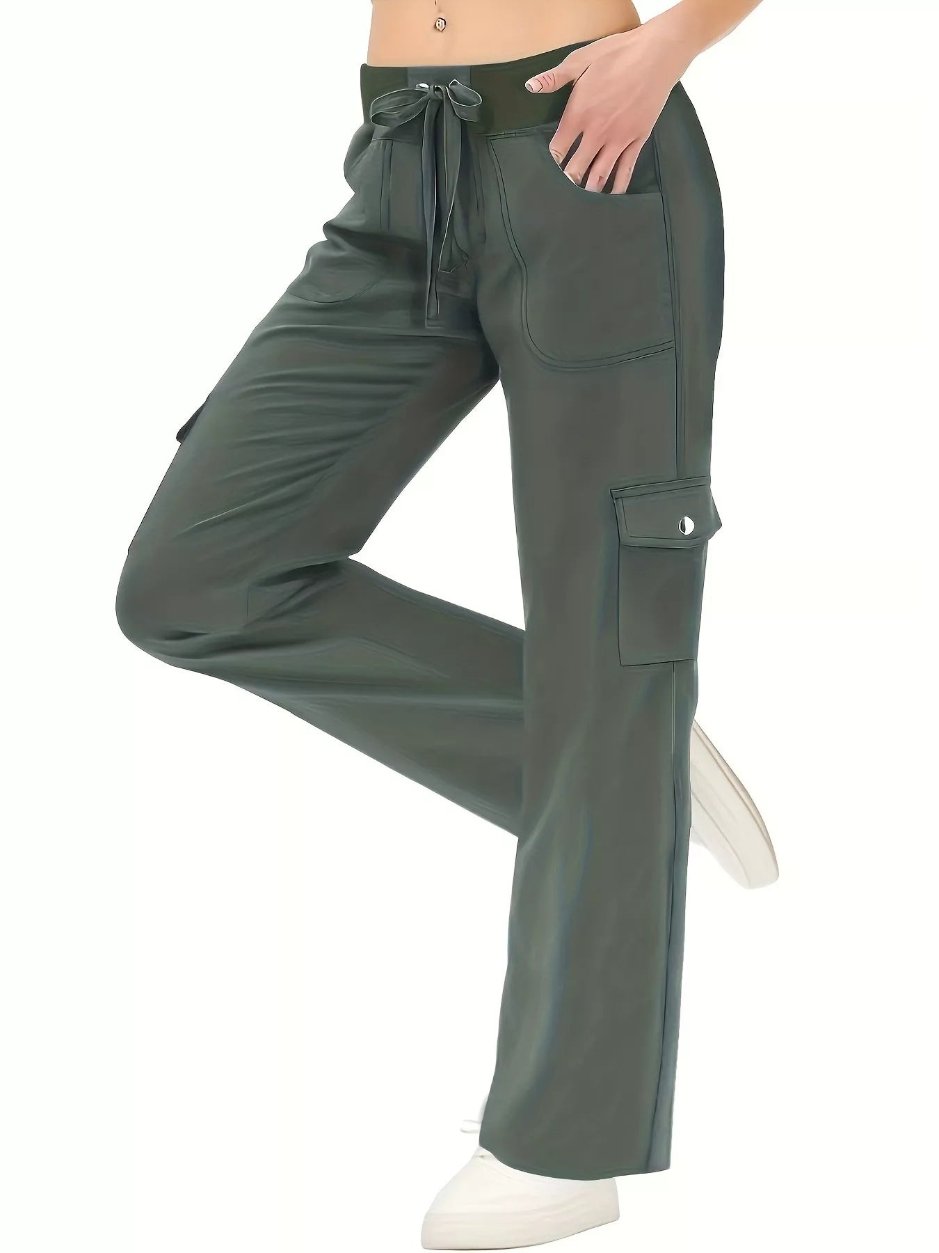 Green cargo pants worn by a person on a white background