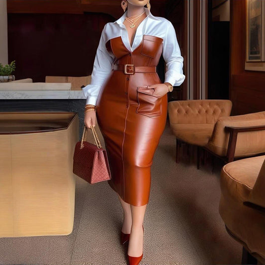 Woman in a brown leather outfit with a white shirt in an indoor setting