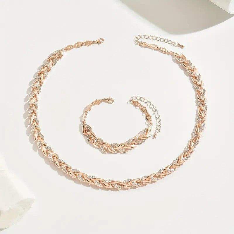 Rose gold braided necklace and bracelet set on a white background