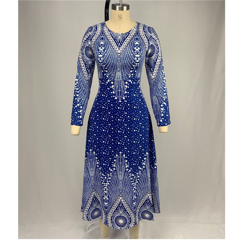 Blue dress with white patterns on a mannequin against a gray background