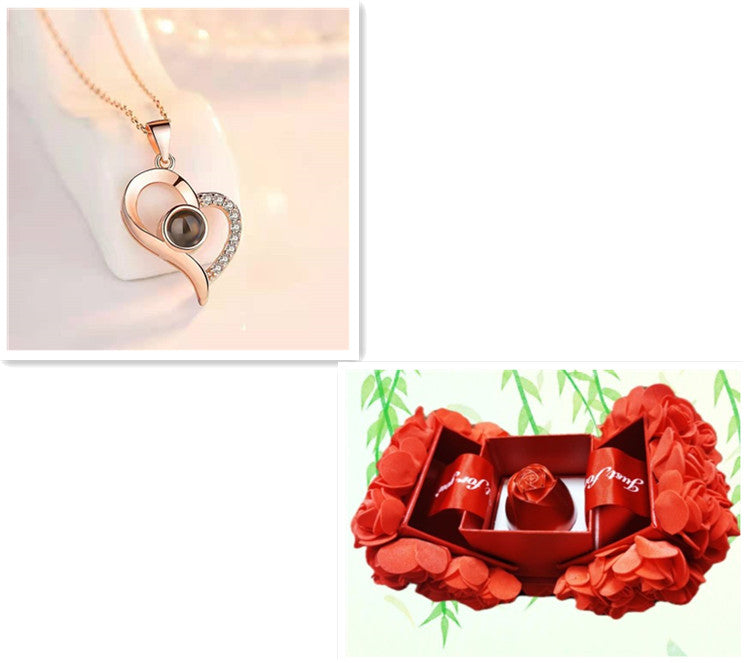 Heart-shaped necklace with a close-up inset and a red box with flowers on a white background