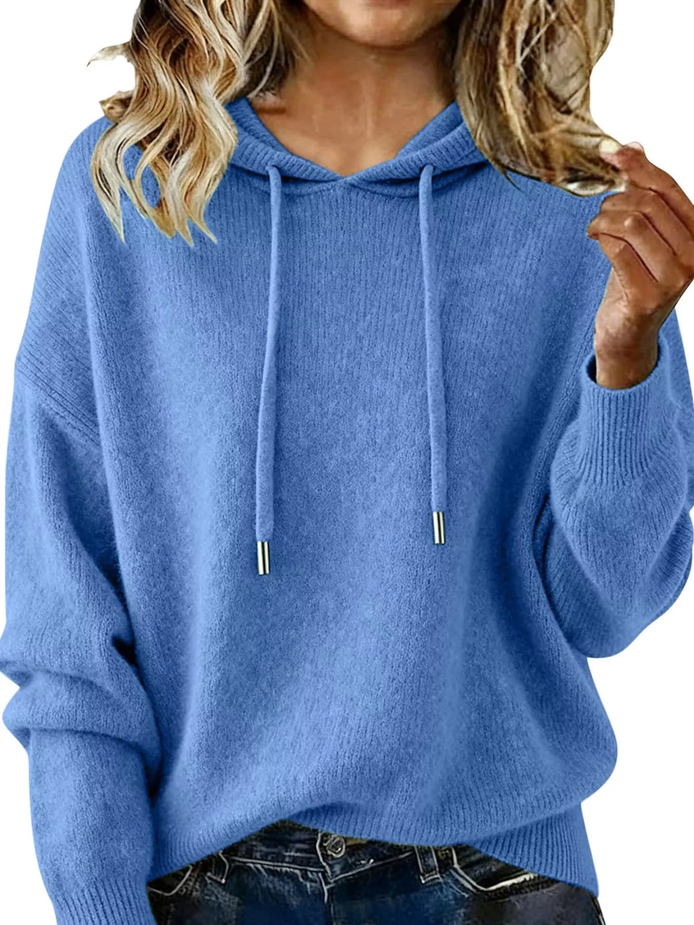 Blue hoodie worn by a person on a white background