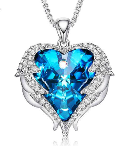 Heart-shaped blue gemstone necklace with silver chain on a white background