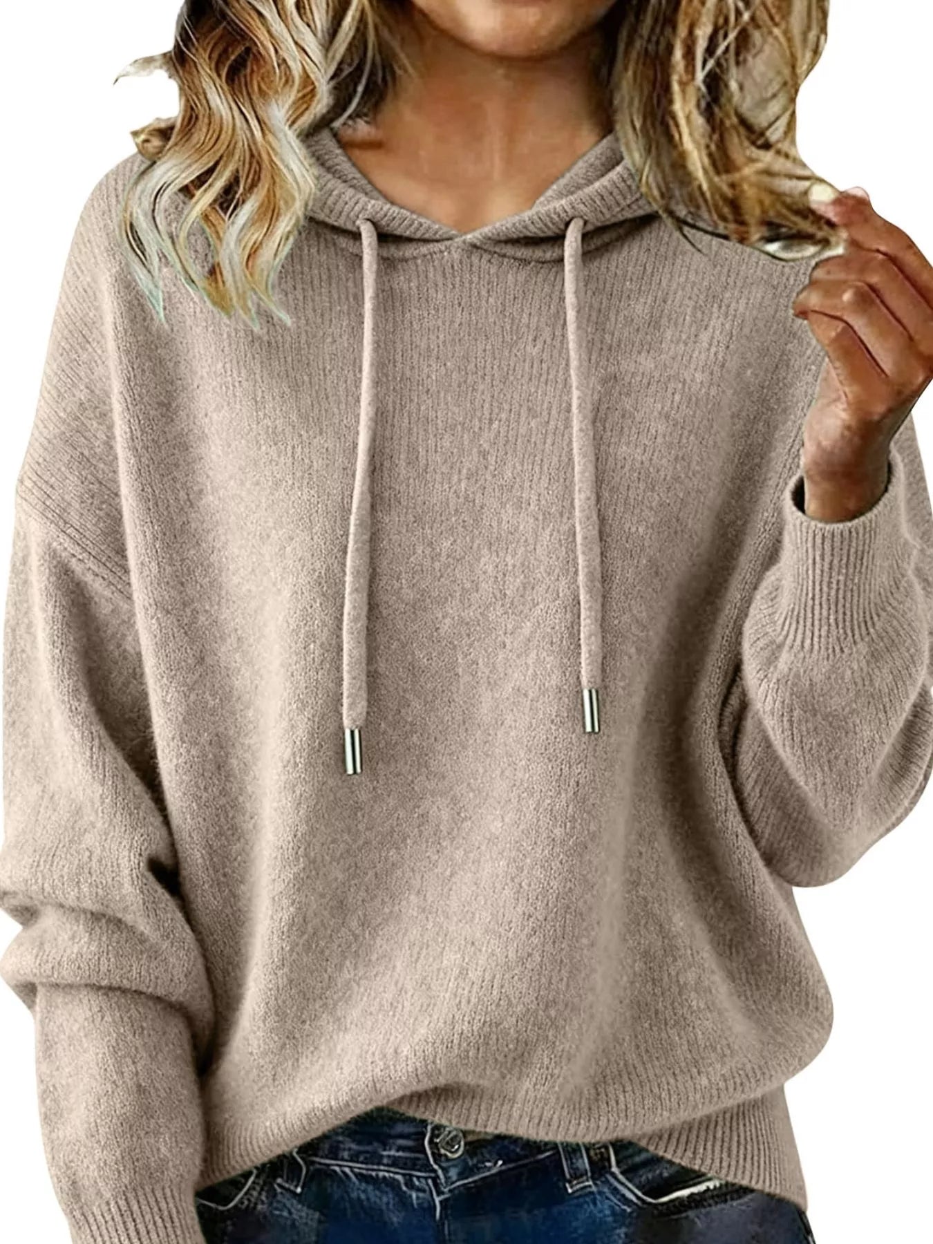 Beige hoodie worn by a person on a white background