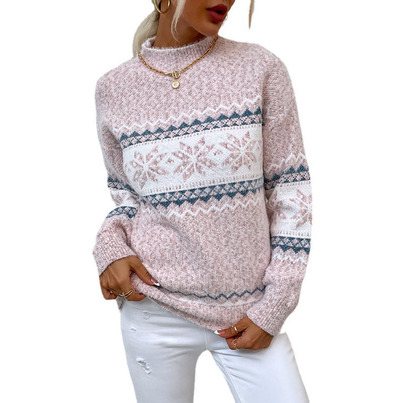 Person wearing a pink sweater with a pattern on a white background