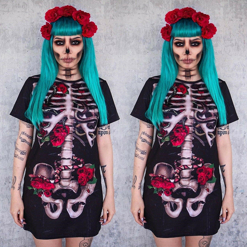 Person wearing a black dress with skeleton and floral design against a gray background