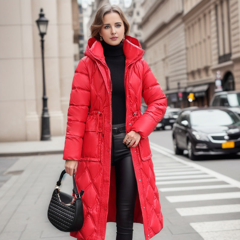 Woman wearing a red puffer coat on a city street