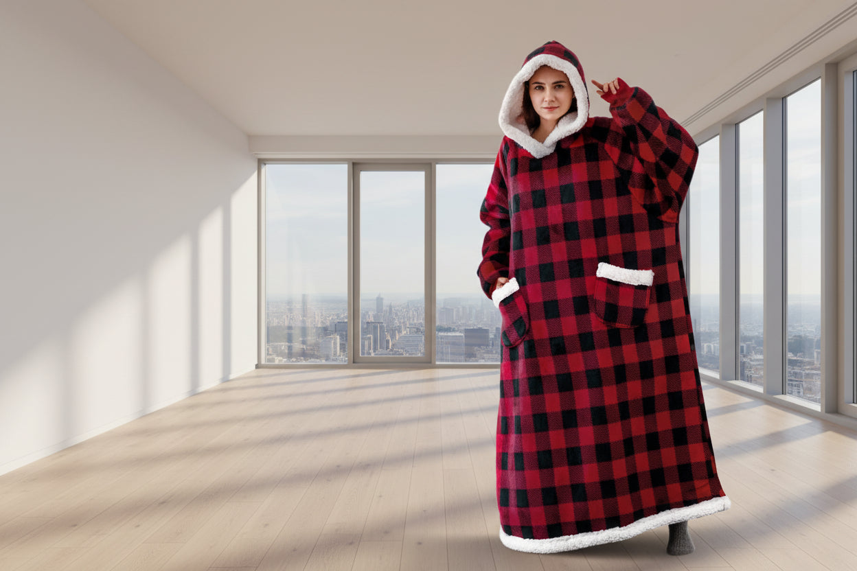 Person wearing a red and black checkered hoodie with white lining in a room