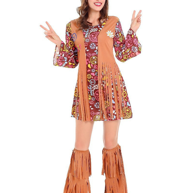 Woman wearing a colorful dress with peace signs and fringe boots on a white background
