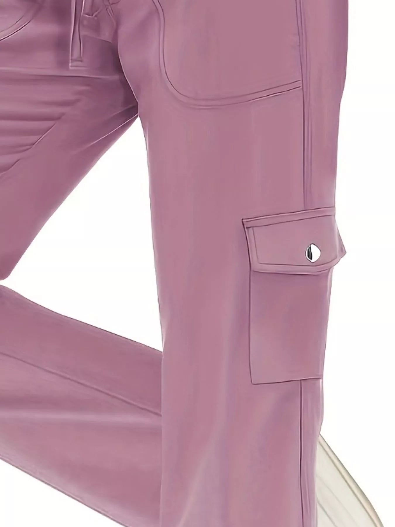 Close-up of a pair of mauve pants with pockets on a white background