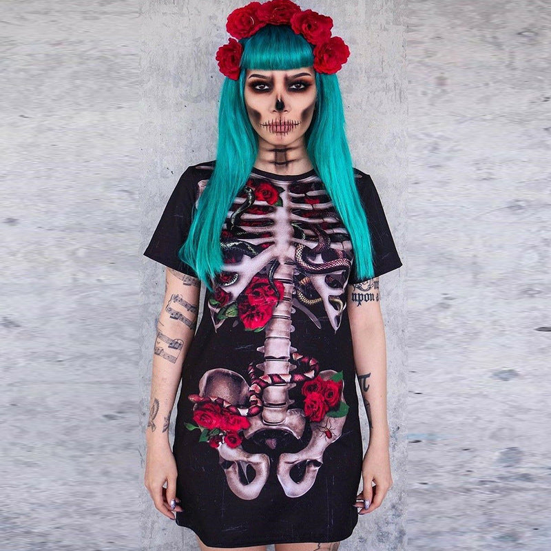 Person wearing a black dress with skeleton and floral design against a gray background