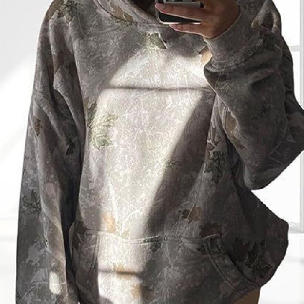 Gray hoodie with floral pattern worn by a person, taking a mirror selfie.