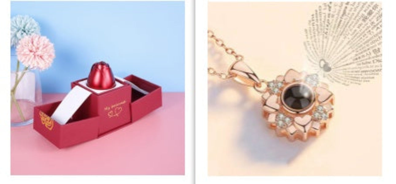 Red jewelry box with a red gemstone and a rose gold necklace with a black stone on a light pink background.