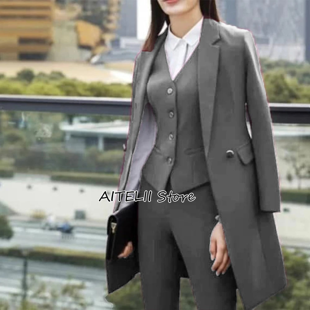Woman wearing a gray suit with a blurred cityscape background