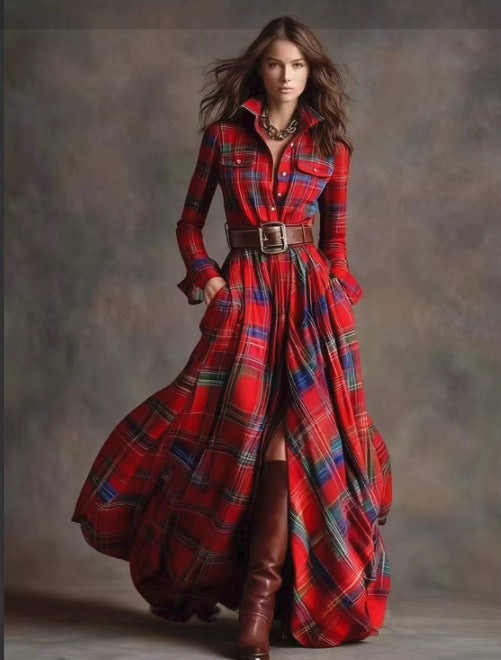 Woman wearing a long red plaid dress with brown boots against a gray background