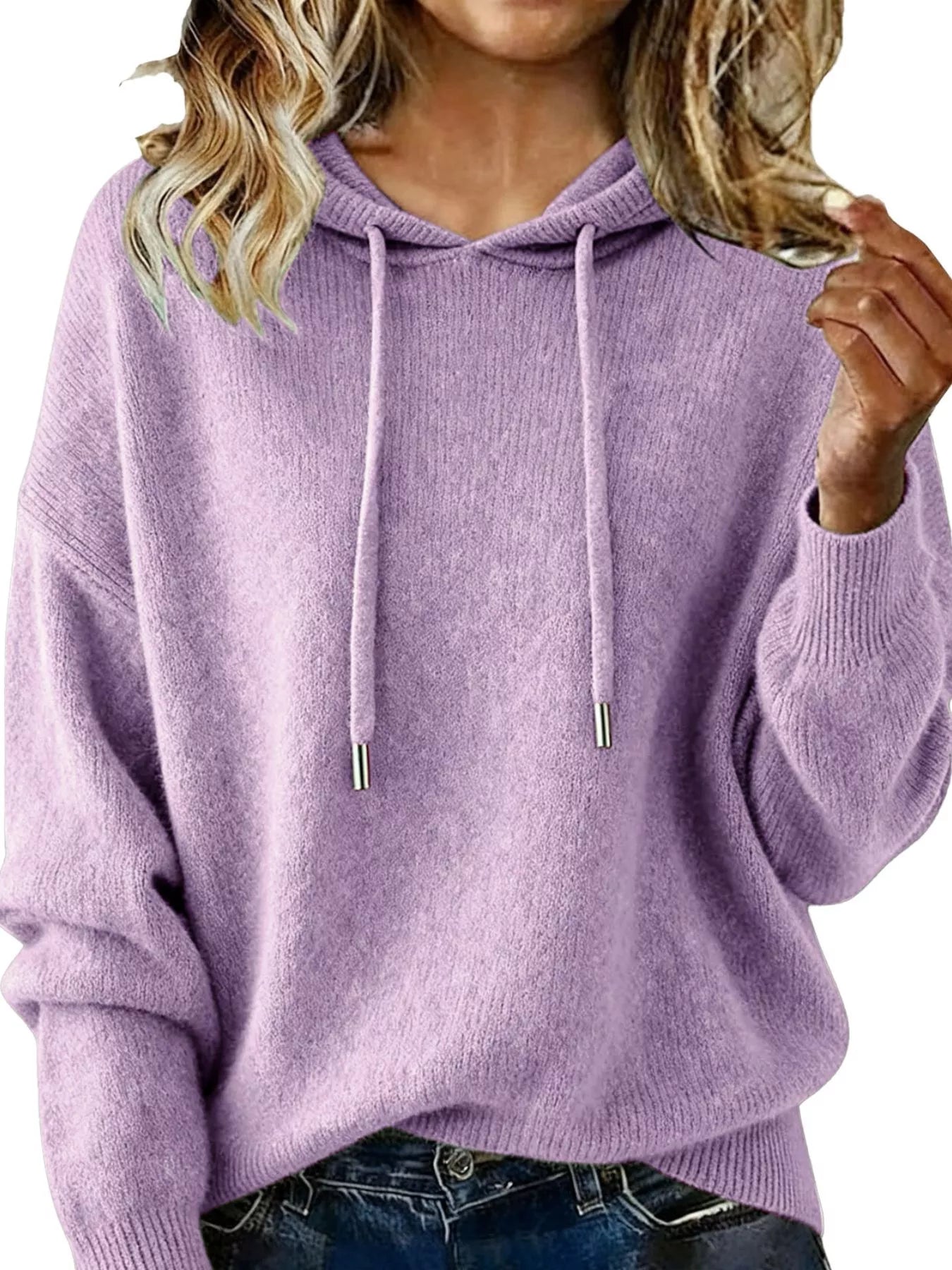 Person wearing a purple hoodie with a plain background