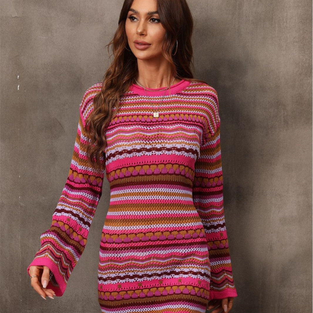Woman wearing a colorful striped sweater against a gray background