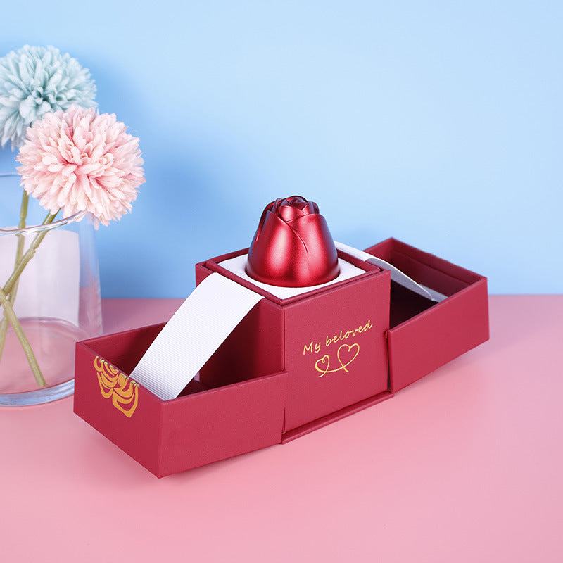Red product in a box with flowers in the background