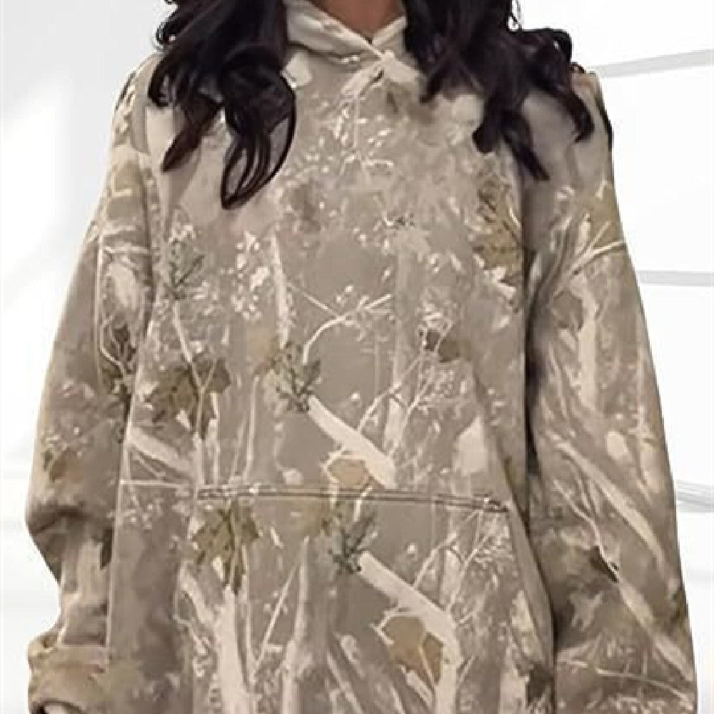 Camouflage hoodie worn by a person on a white background
