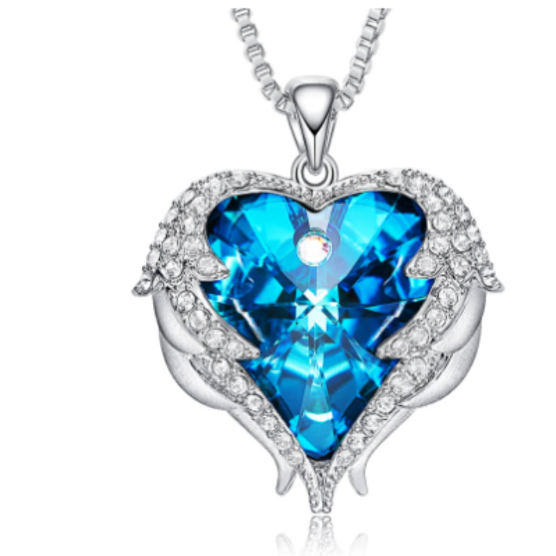 Heart-shaped blue crystal pendant on a white background