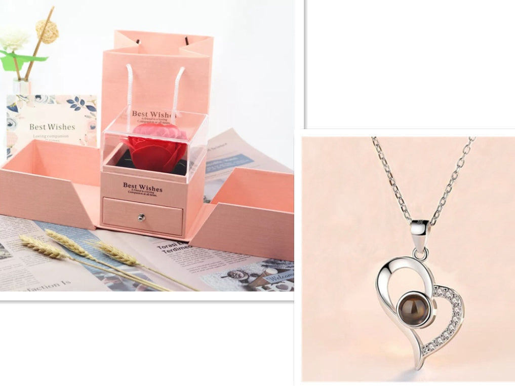 Silver heart-shaped necklace with a brown stone in a pink 'Best Wishes' box.