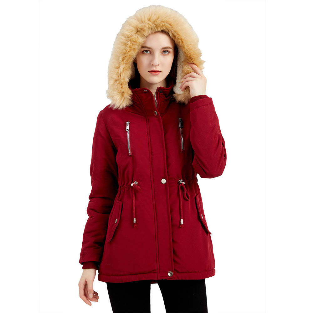 Red parka coat with beige fur hood on a white background
