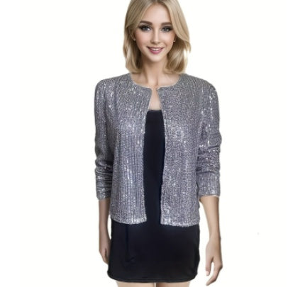 Woman wearing a silver sequin jacket over a black dress on a white background