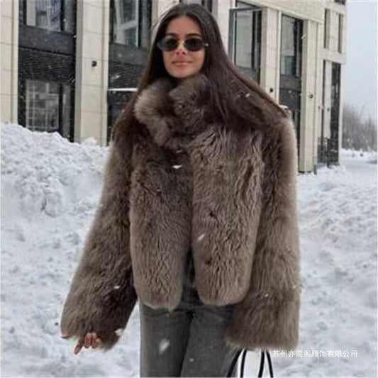 Woman wearing a fur coat in a snowy outdoor setting