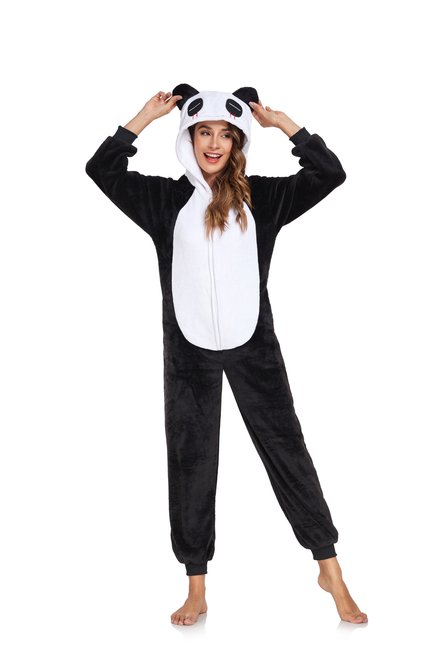 Person wearing a panda onesie on a white background