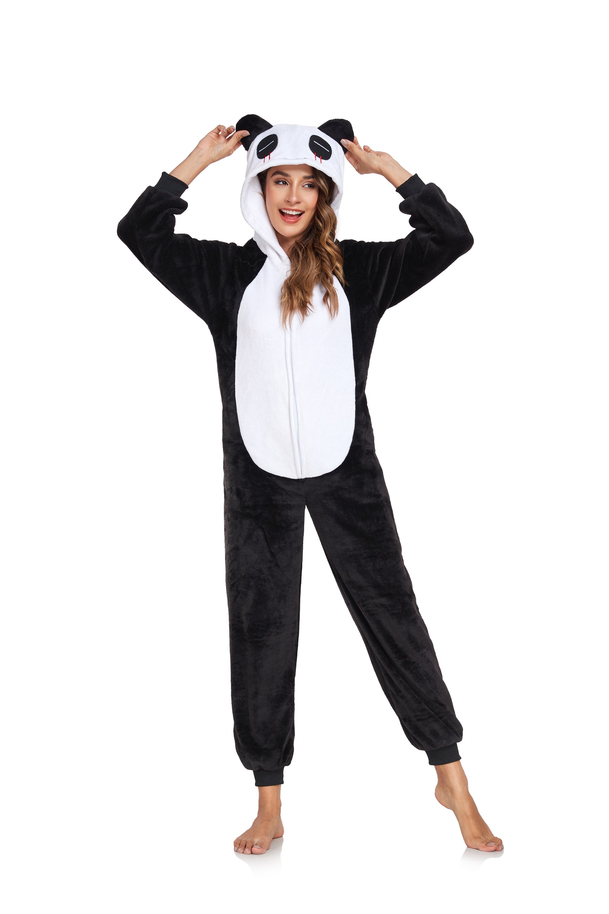 Person wearing a panda onesie on a white background