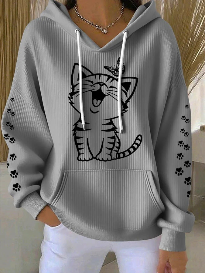 Gray hoodie with a cat graphic and paw prints on a neutral background