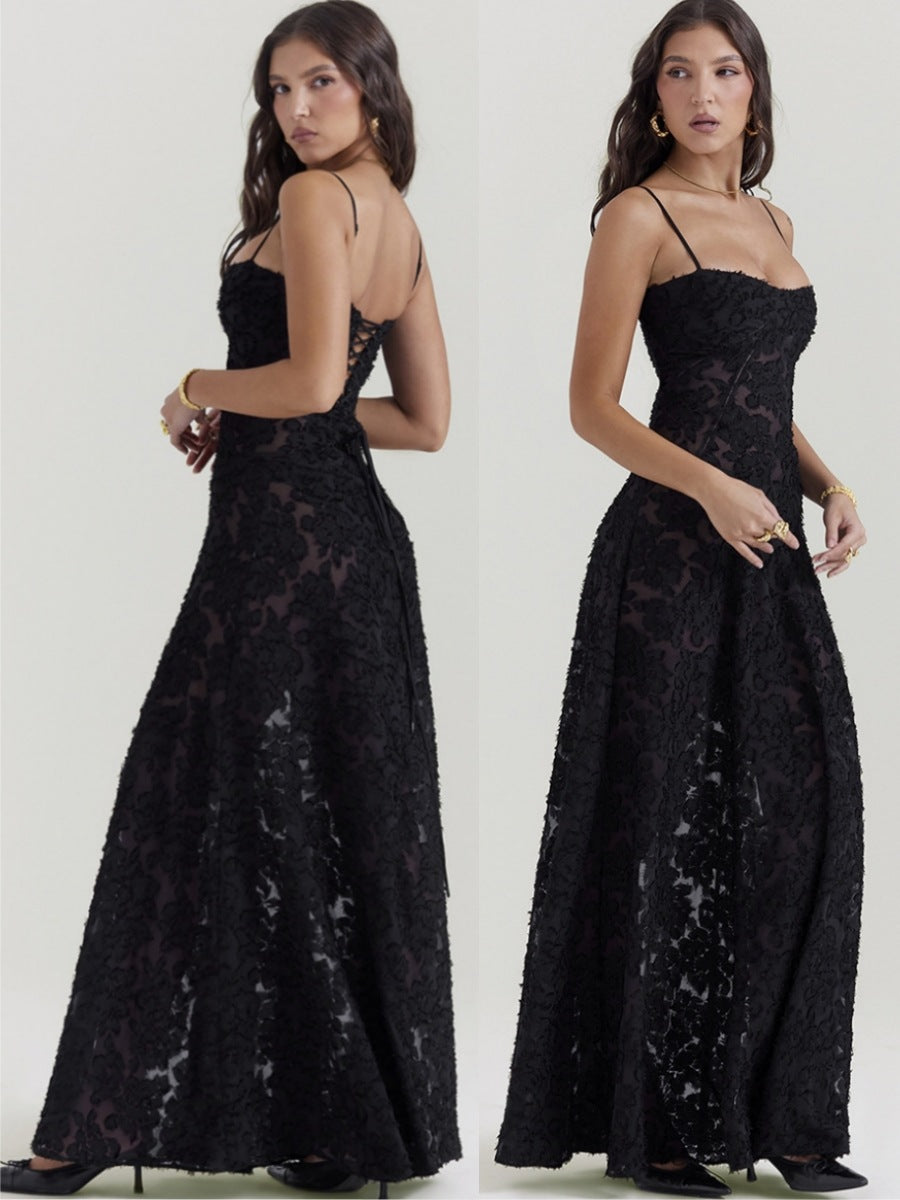 Black lace evening gown worn by a model on a white background
