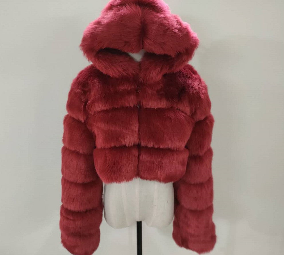 Red fur jacket on a mannequin against a white background