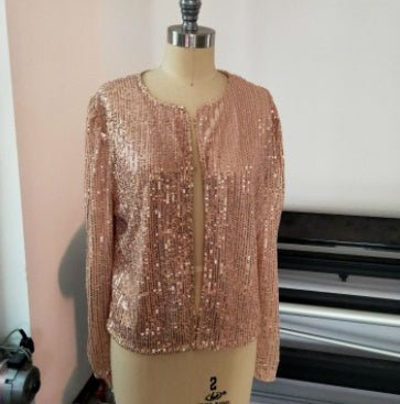 Rose gold sequin top on a mannequin against a white background