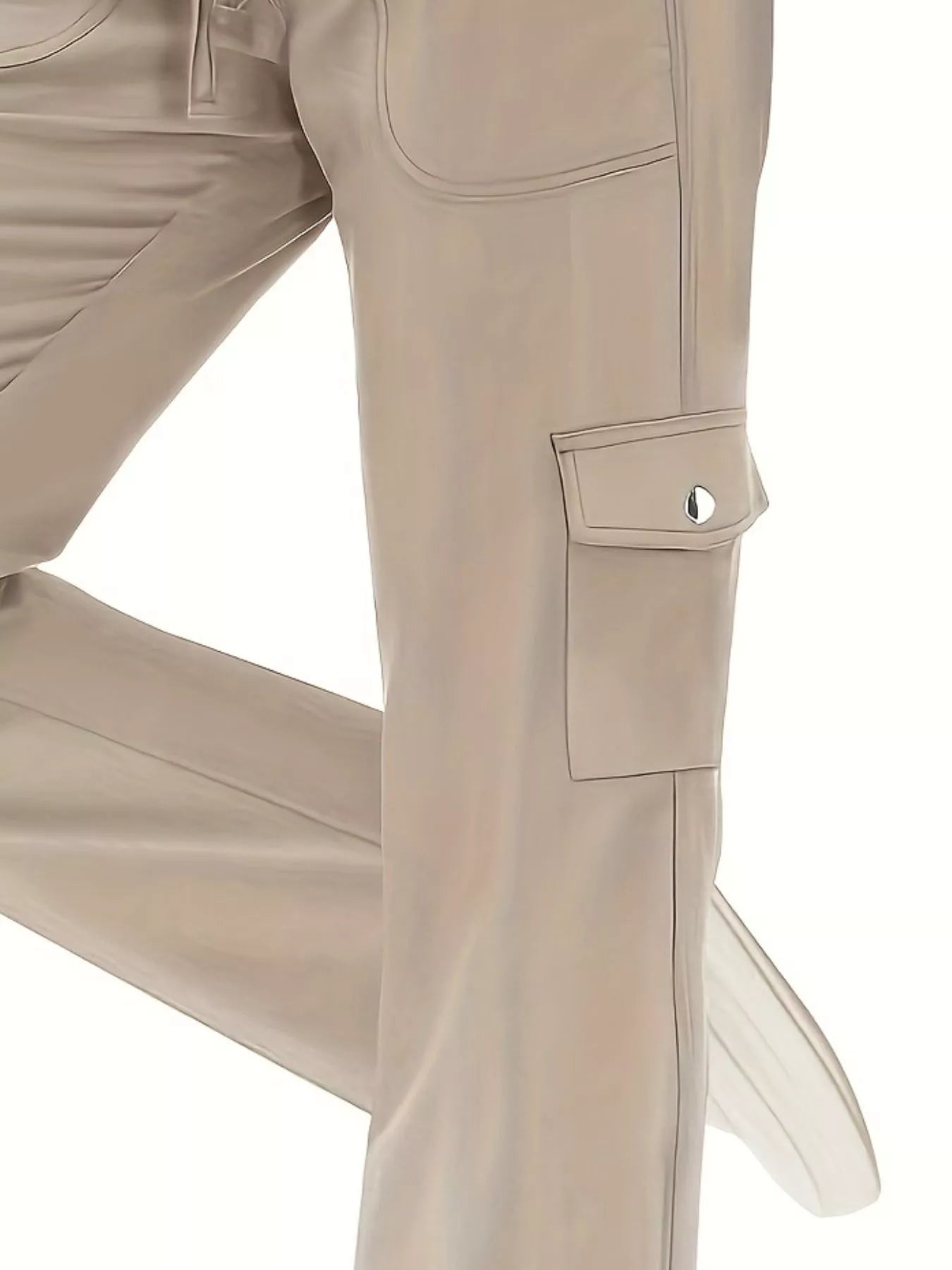 Close-up of beige pants with a pocket on a white background